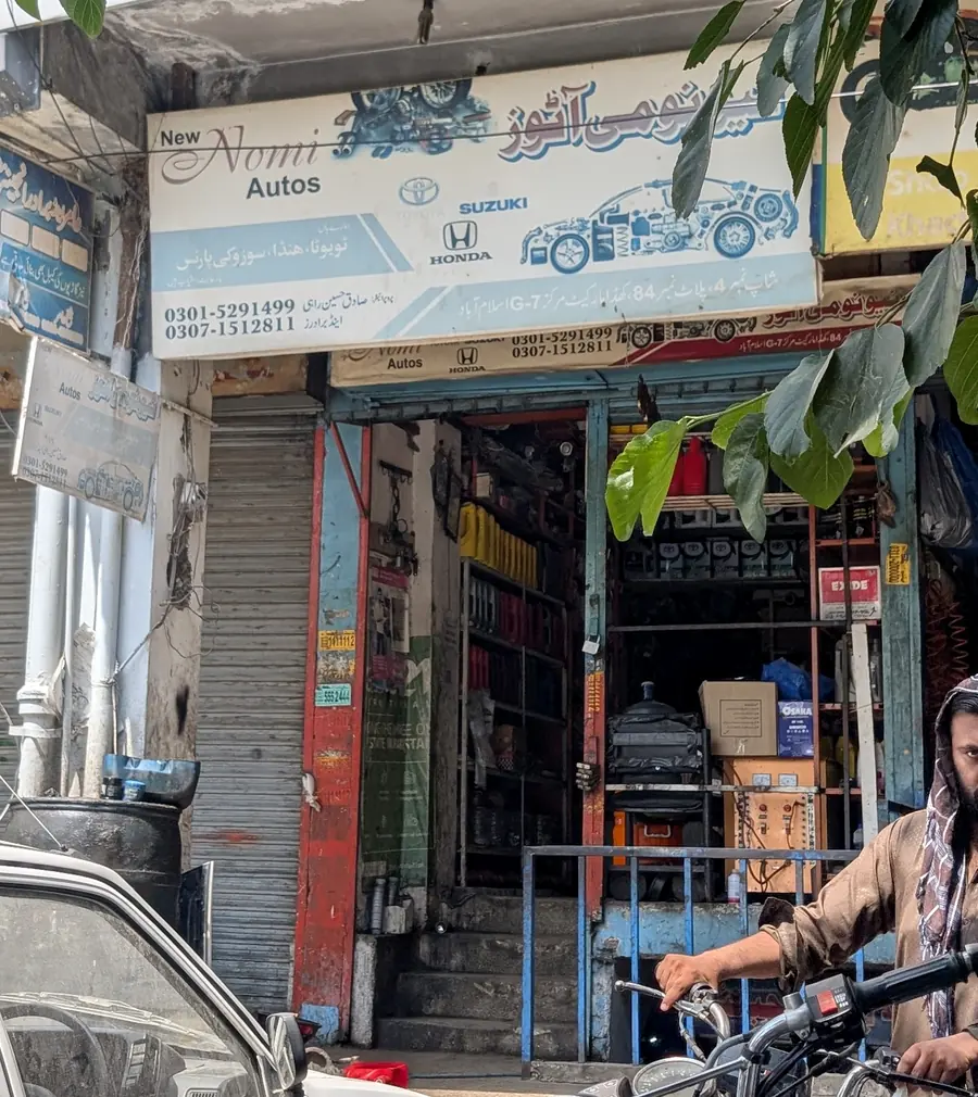 The New Nomi Autos shop front and sign in Khadda Market, G-7 Markaz